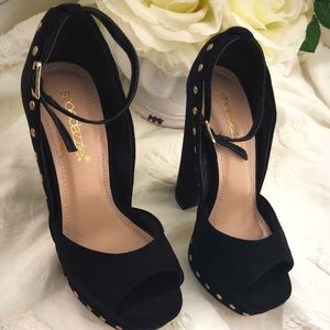 Never worn black platform studded pumps.